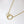 Gold necklace with interlocking rings on a white background