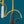 Two pocket knives on yellow strings against a blue background