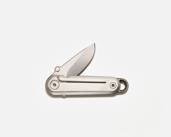 Silver pocket knife on a white background