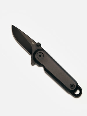Black folding knife on a white background
