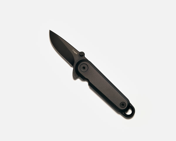 Black folding knife on a white background