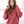 Woman wearing a red hoodie in front of a window