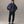 fit model with his hands on his arms wearing The Maritime Shirt Jacket in Heather Navy Wool
