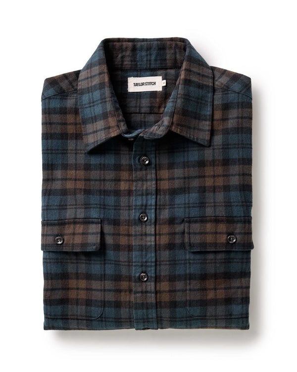 Plaid shirt with a visible brand label on a white background