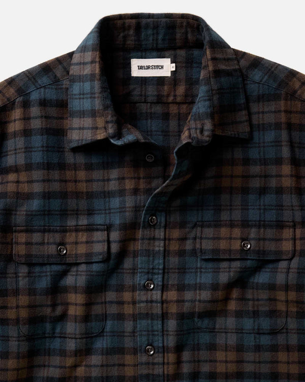 Plaid shirt with a visible brand label on a white background